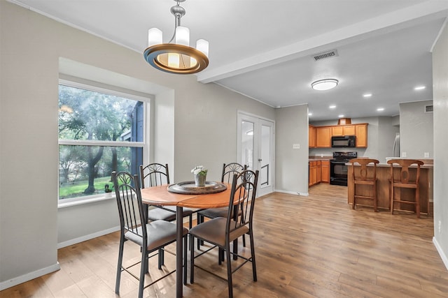 dining room with light wood-type flooring