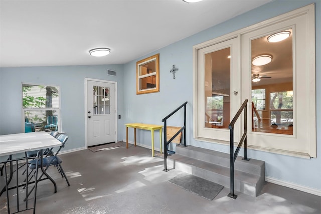 foyer with vaulted ceiling and ceiling fan