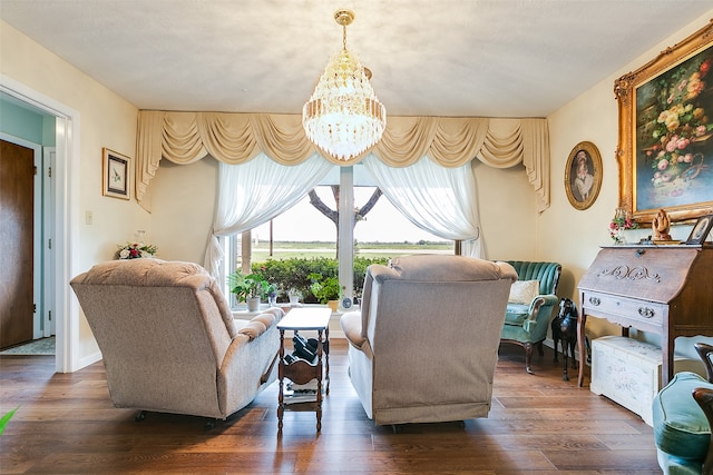 living room with dark wood-type flooring and a chandelier