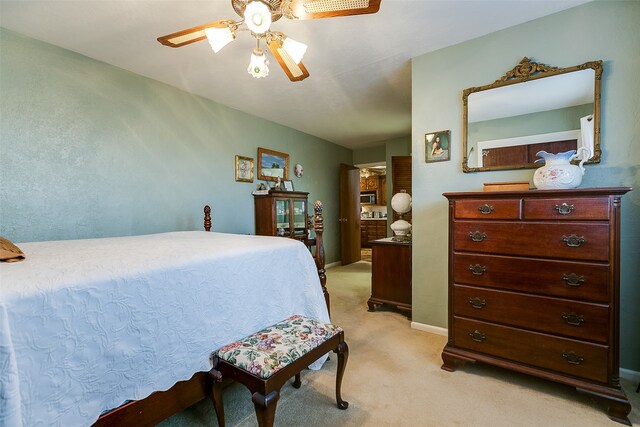 bedroom with light colored carpet and ceiling fan