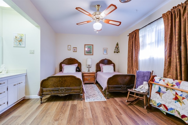 bedroom with light wood-type flooring and ceiling fan