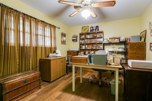 office with ceiling fan and hardwood / wood-style flooring