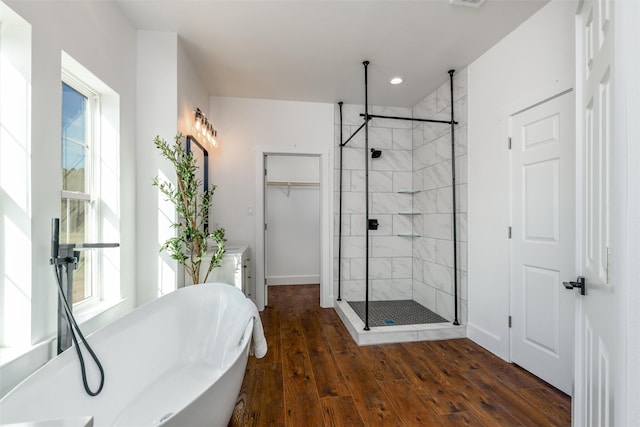 bathroom featuring vanity, hardwood / wood-style floors, and independent shower and bath