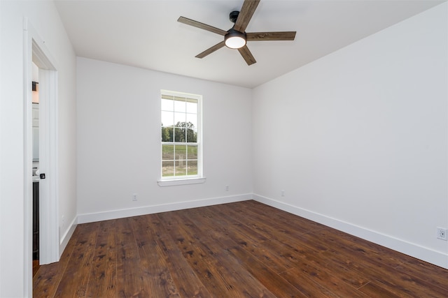 unfurnished room with dark wood-type flooring and ceiling fan