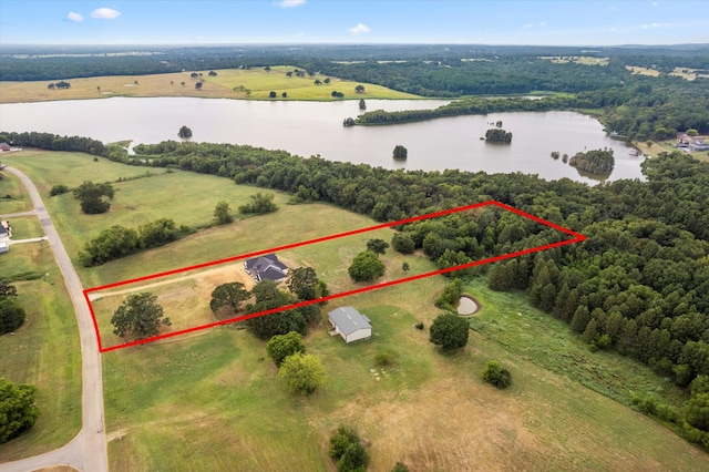 aerial view featuring a rural view and a water view