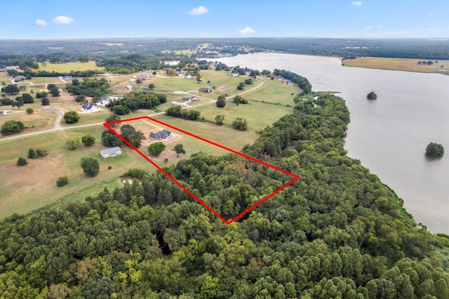 drone / aerial view featuring a water view and a rural view