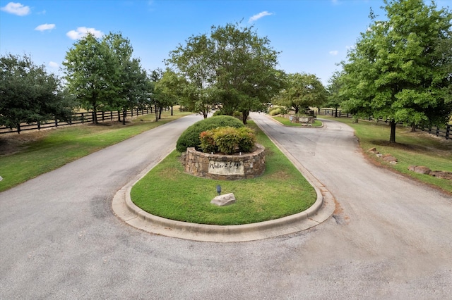 view of home's community featuring a yard