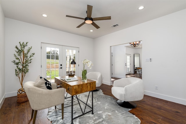 home office with ceiling fan with notable chandelier, dark wood-type flooring, and french doors