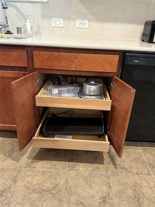 interior details with black dishwasher and sink