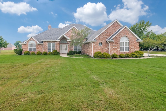 view of front of home with a front yard