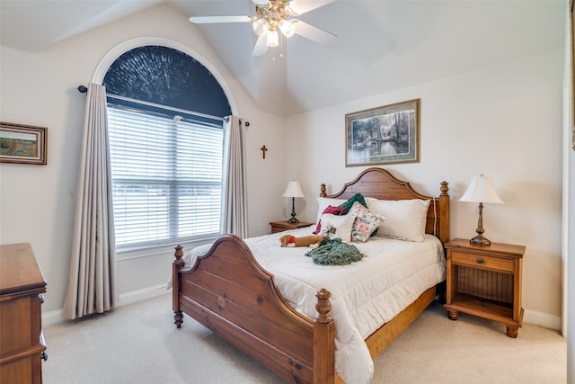 bedroom featuring light colored carpet, ceiling fan, and vaulted ceiling