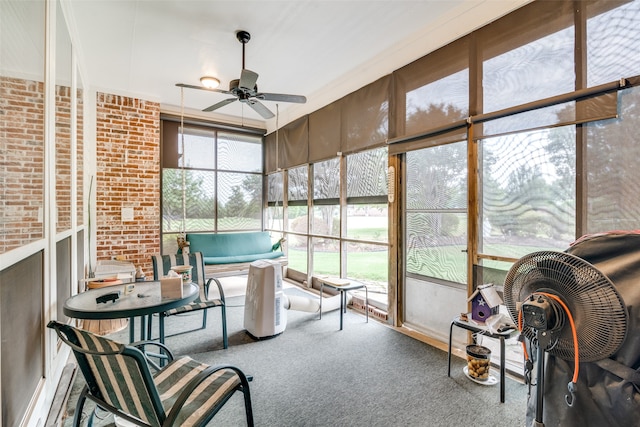 sunroom featuring a wealth of natural light and ceiling fan