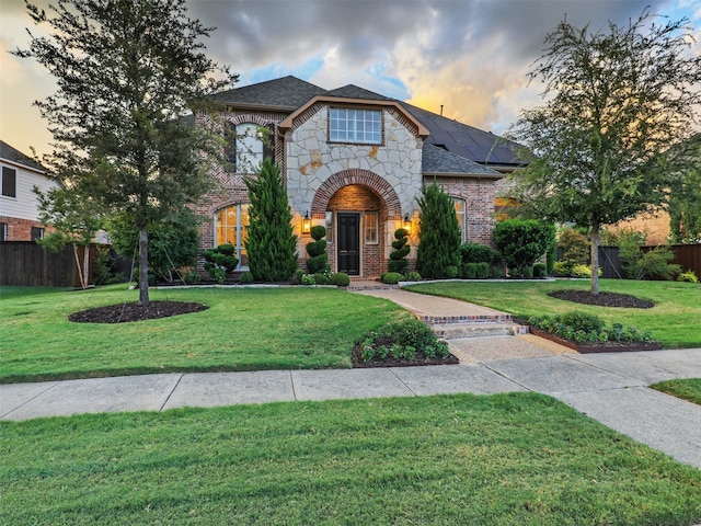 view of front of property with a lawn