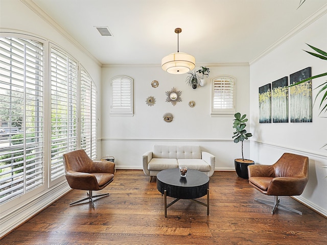 living room with crown molding and dark hardwood / wood-style floors