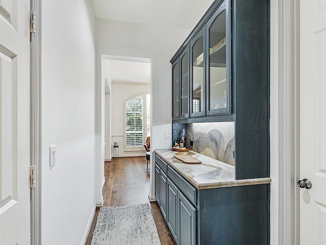 interior space with tasteful backsplash and dark hardwood / wood-style floors