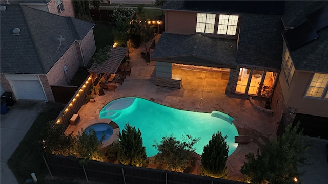 view of swimming pool with a patio area and an in ground hot tub