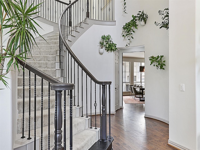 stairs with wood-type flooring