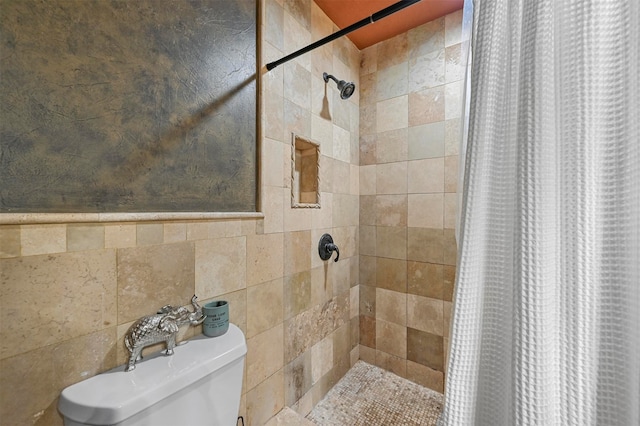 bathroom featuring tile walls and walk in shower