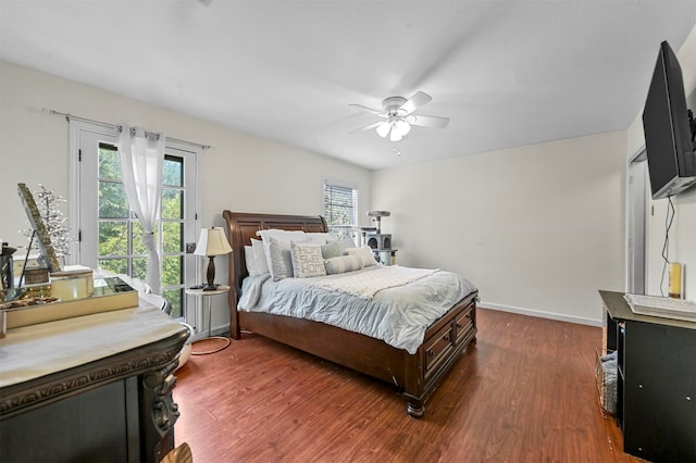 bedroom with dark wood-type flooring and ceiling fan