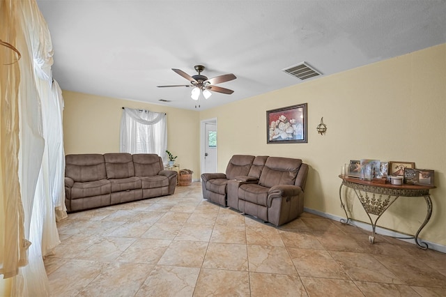 living room featuring ceiling fan