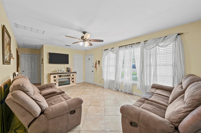 living room with ceiling fan and light tile patterned floors