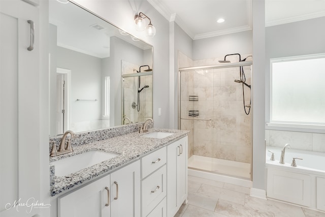 bathroom with vanity, separate shower and tub, and ornamental molding