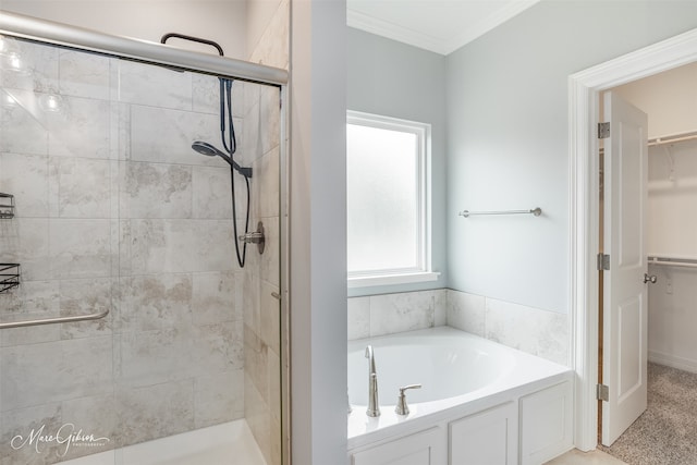 bathroom with crown molding and shower with separate bathtub