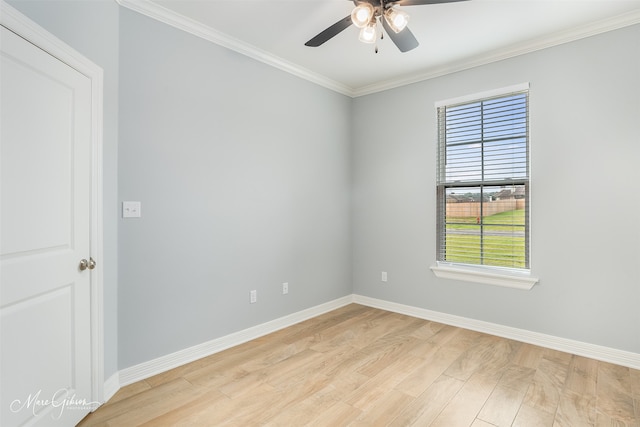 spare room featuring ceiling fan, light hardwood / wood-style floors, and ornamental molding