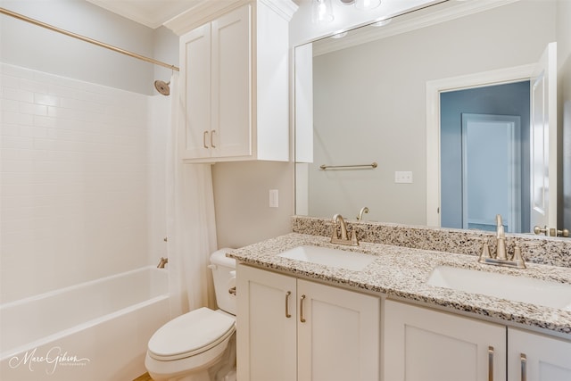 full bathroom featuring ornamental molding, vanity, toilet, and bathtub / shower combination