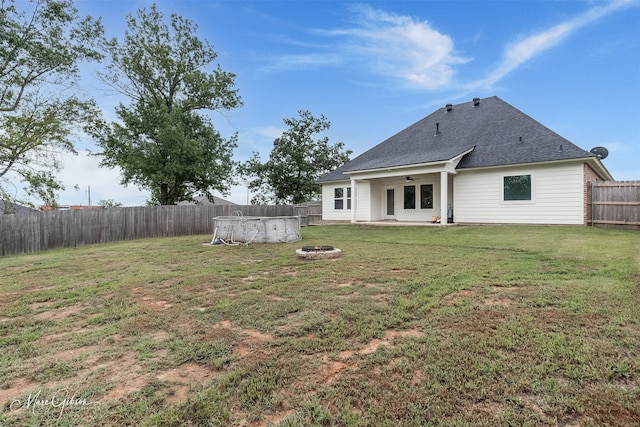 view of yard featuring a patio area and an outdoor fire pit