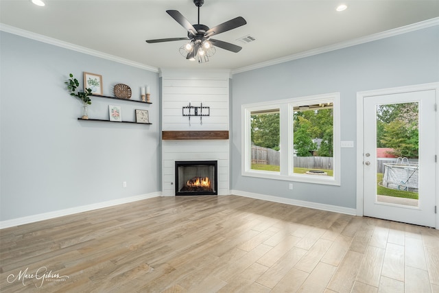 unfurnished living room with a fireplace, crown molding, light hardwood / wood-style flooring, and ceiling fan