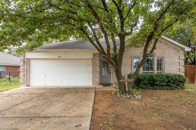 ranch-style home featuring a garage