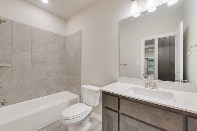 full bathroom with tile patterned floors, vanity, toilet, and tiled shower / bath combo