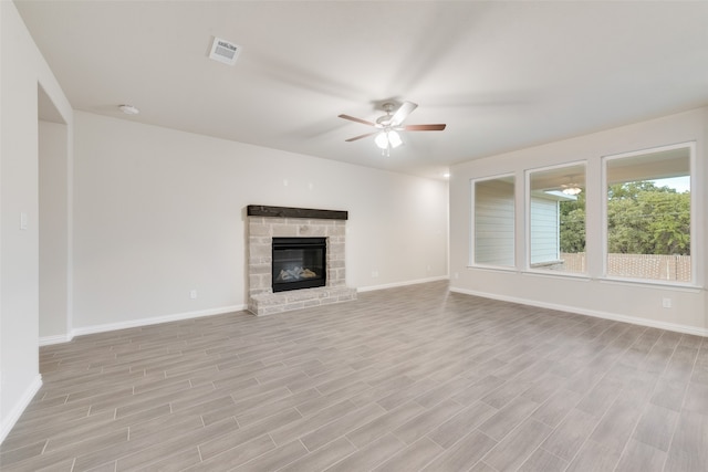 unfurnished living room featuring light wood-type flooring and ceiling fan