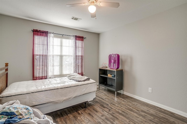 bedroom with ceiling fan and hardwood / wood-style flooring