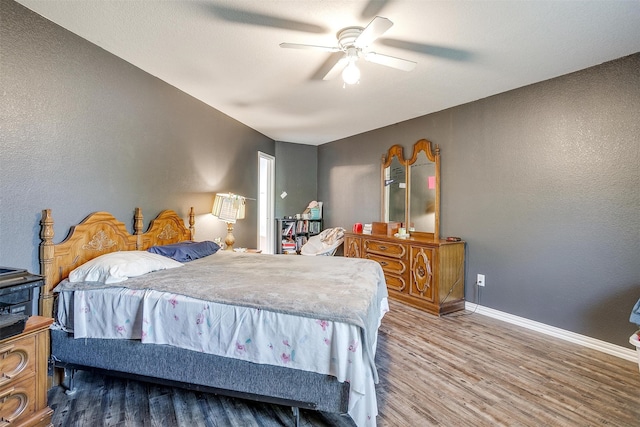 bedroom featuring ceiling fan and hardwood / wood-style flooring