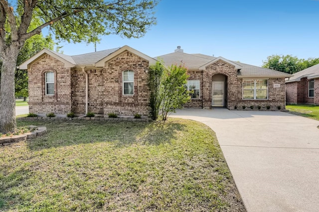 ranch-style house with a front lawn