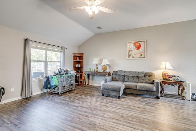 living room with lofted ceiling, ceiling fan, and hardwood / wood-style flooring