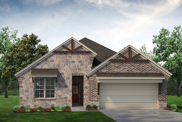 view of front of home featuring a garage and a front yard