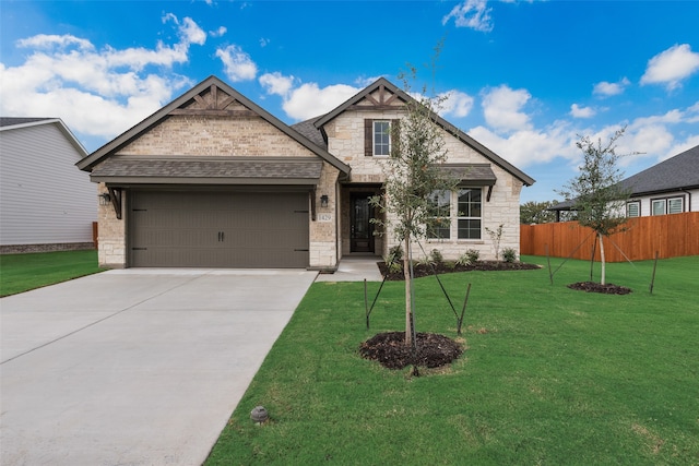 craftsman inspired home featuring a front lawn and a garage