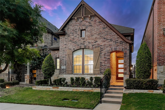 view of front of property with a yard