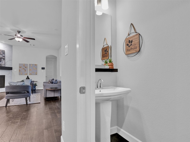 bathroom featuring ceiling fan, sink, and hardwood / wood-style flooring