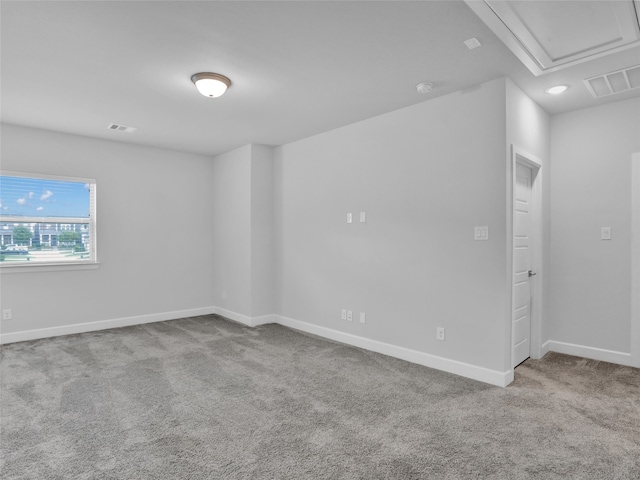 unfurnished room with light carpet