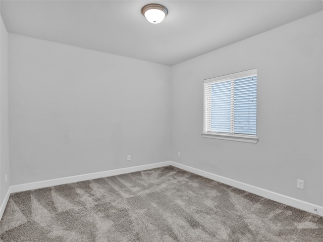 empty room with carpet flooring