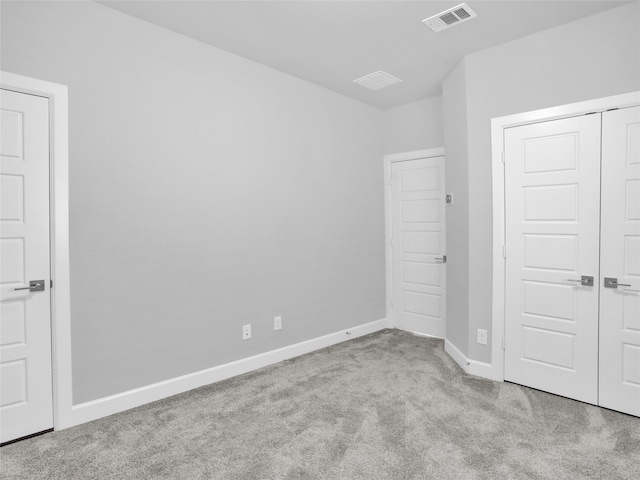 unfurnished bedroom with light carpet