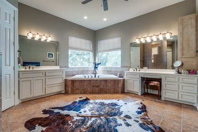 bathroom with tile patterned flooring, vanity, ceiling fan, and separate shower and tub