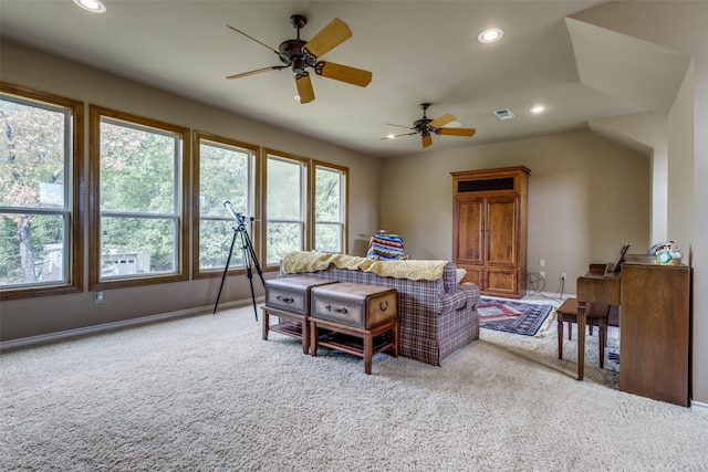 living room featuring carpet flooring and ceiling fan