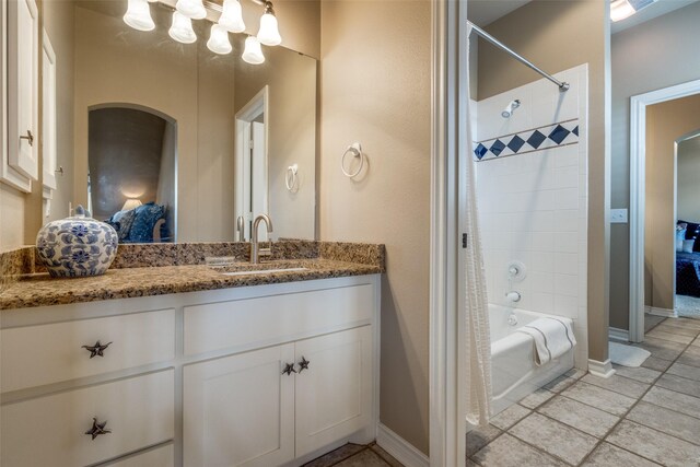 bathroom featuring vanity, shower / bath combination with curtain, and tile patterned flooring