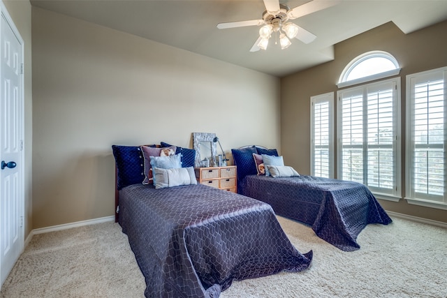 carpeted bedroom featuring ceiling fan