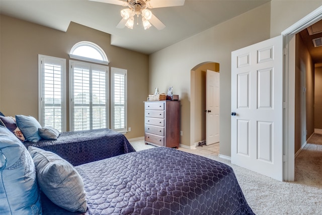 bedroom with light carpet and ceiling fan